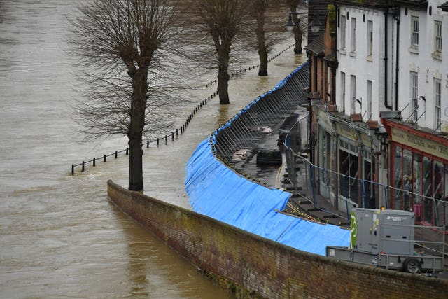 Temporary flood barriers hold back the river Severn in Ironbridge
