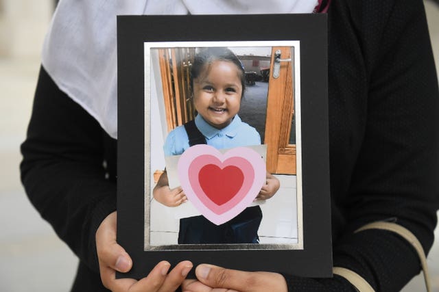 Shelina Begum holds a picture of her five-year-old daughter Tafida Raqeeb 
