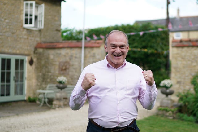 Ed Davey, with clenched fists, celebrates the local election results