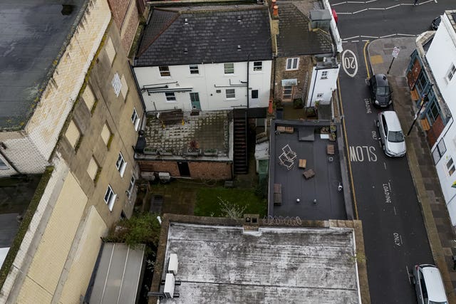 A view of the shared back garden of two neighbouring properties on Bethnal Green Road, east London, where the family of Muriel McKay believe her remains are buried