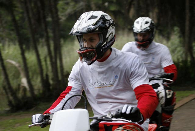 William pictured with brother Harry behind him on the eve of their endurance bike ride race in South Africa in 2008. (Jerome Delay/PA Archive/PA Images)