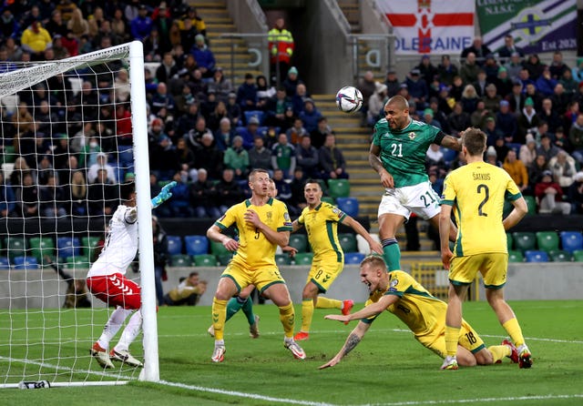 Josh Magennis, top right, heads home before the goal is disallowed