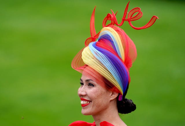 A racegoer wears a fascinator with the word love on it during day three of Royal Ascot at Ascot Racecourse
