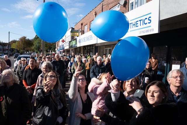 Shopkeepers and local residents release balloons