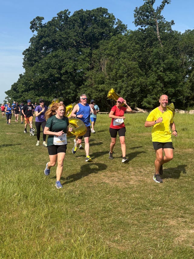 Darren Wood (right) during Morden parkrun in south London, his 1,000th parkrun