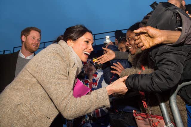 Harry and Meghan meet members of the public following a visit to youth-orientated radio station, Reprezent FM, in Brixton, south London last year. (Dominic Lipinski/PA)