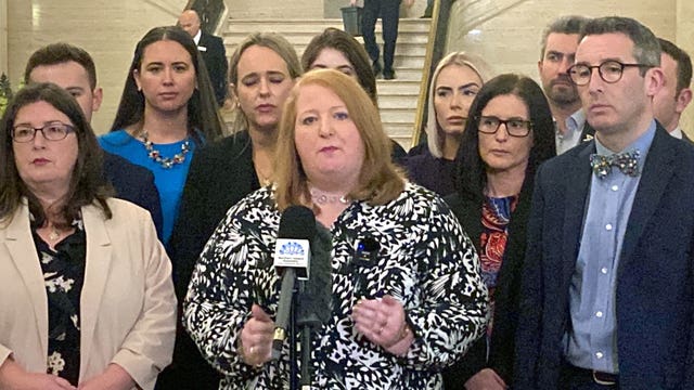 Alliance Party leader Naomi Long, centre, speaking to the media at Parliament Buildings Stormont, Belfast