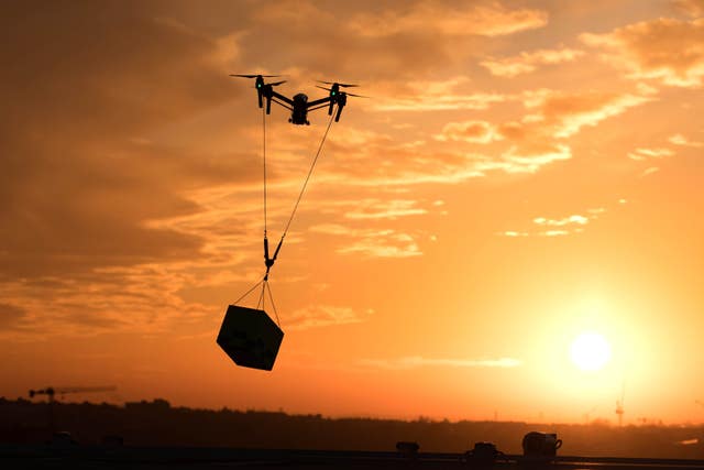 A drone carrying a load
