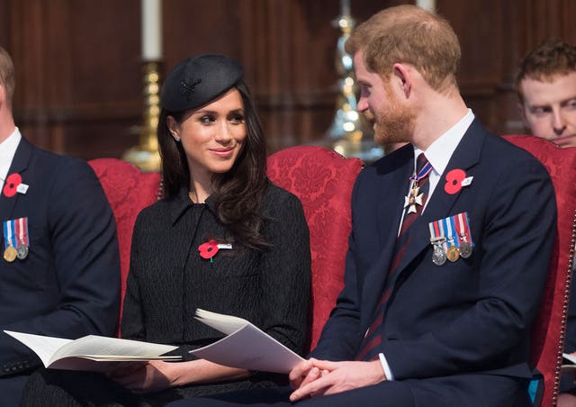 Meghan , with Harry during a service to commemorate Anzac Day, will become a British citizen (Eddie Mulholland/Daily Telegraph/PA)