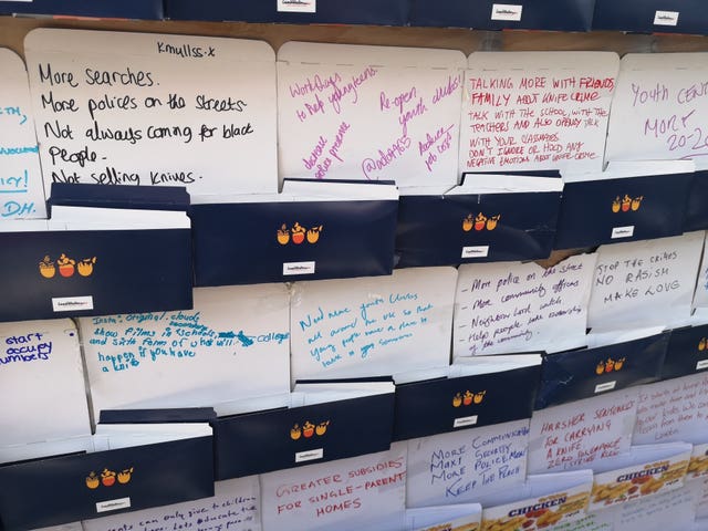 Solutions to knife crime written on chicken boxes and pinned on a board