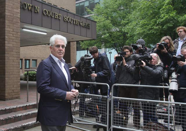 Max Clifford leaving court