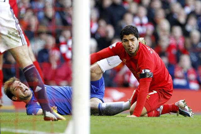Liverpool’s Luis Suarez (right) and Chelsea’s Branislav Ivanovic (left)