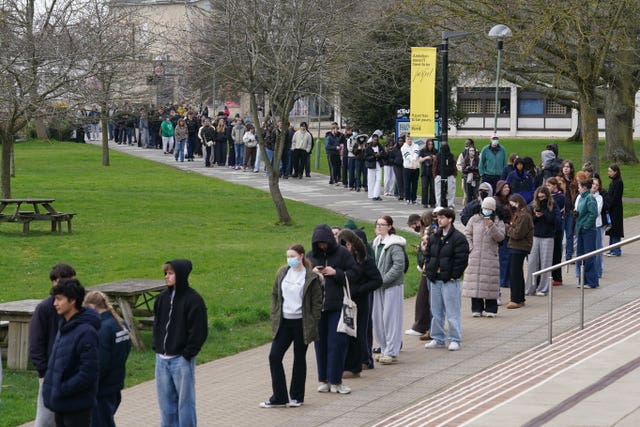 Students queuing for antibiotics outside a building at the University of Kent in Canterbury