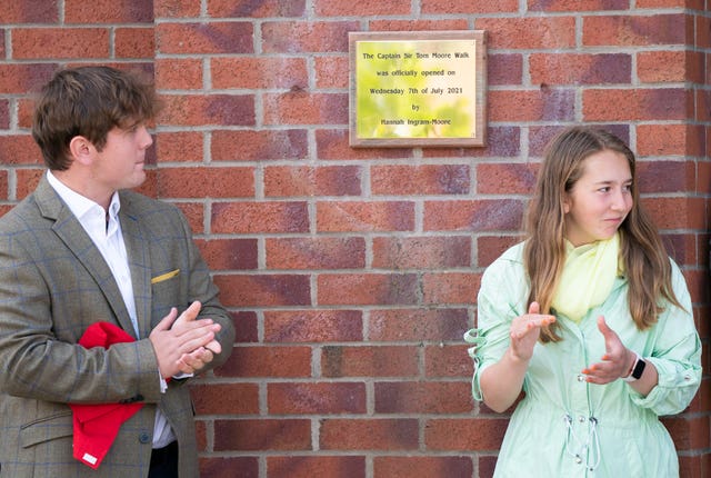 Benjie, left, and Georgia Ingram-Moore unveil a plaque at the Army Foundation College