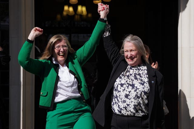Susan Smith and Marion Calder celebrate outside court