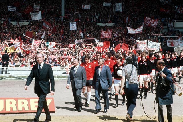 Tommy Docherty leads Manchester United out at Wembley for the 1977 FA Cup final