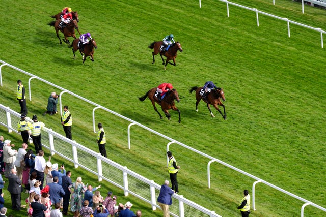 Nashwa (green) chases home Tuesday and Emily Upjohn at Epsom