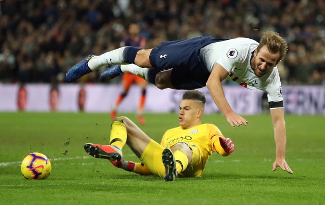 Ederson makes a challenge on Tottenham's Harry Kane