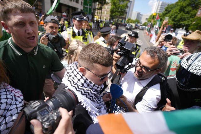 Kneecap’s Liam Og O hAnnaidh leaves Westminster Magistrates’ Court in London through a crowd of supporters