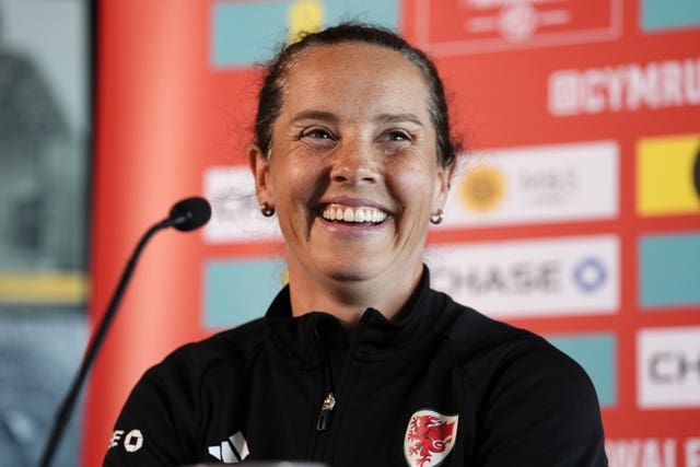 Wales Women head coach Rhian Wilkinson smiles at her Euro 2025 squad announcement press conference
