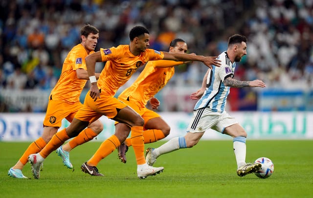 Lionel Messi accelerates away from Netherlands trio Cody Gakpo, Marten de Roon and Virgil van Dijk