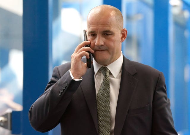 Jake Berry speaks into his mobile phone during a Conservative Party conference