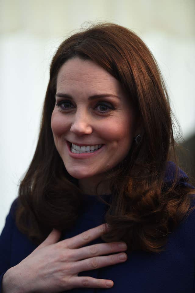 The Duchess of Cambridge carried on smiling after getting her heel caught briefly (Eddie Mulholland/Daily Telegraph/PA)
