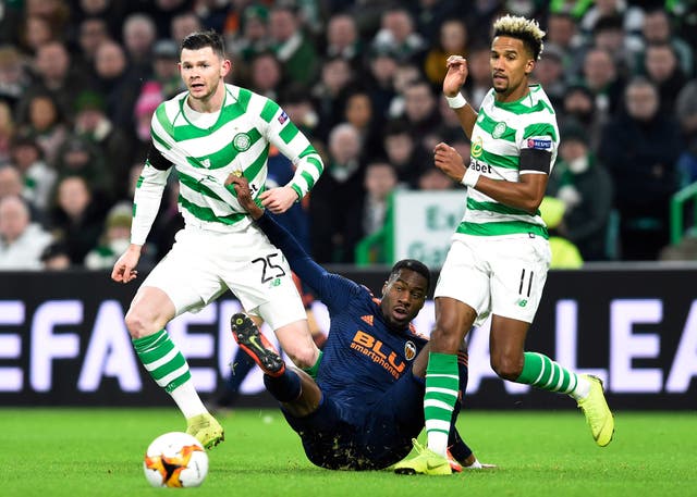 Oliver Burke, left, battles with Valencia's Geoffrey Kondogbia