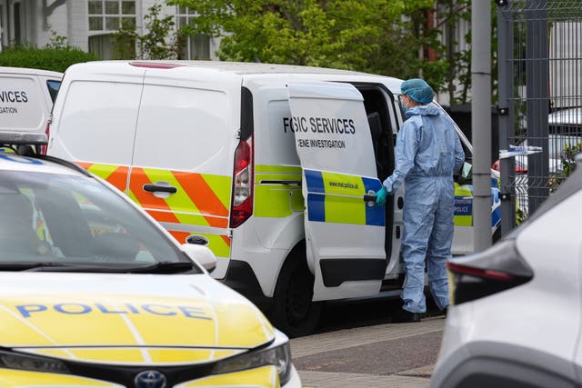 A police forensic officer outside Finchley Reform Synagogue in north London after an attempted arson attack