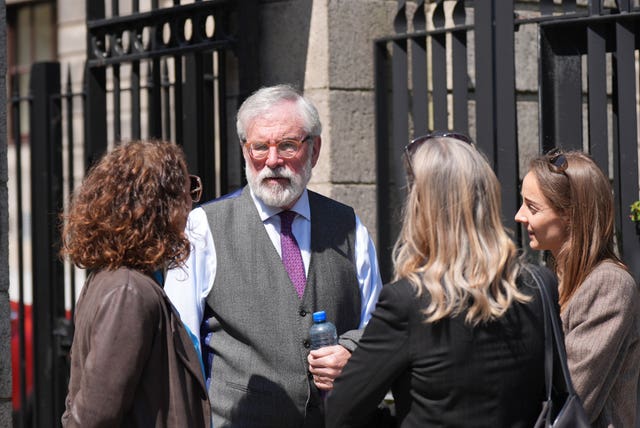 Former Sinn Fein president Gerry Adams speaks with members of the public outside the High Court in Dublin