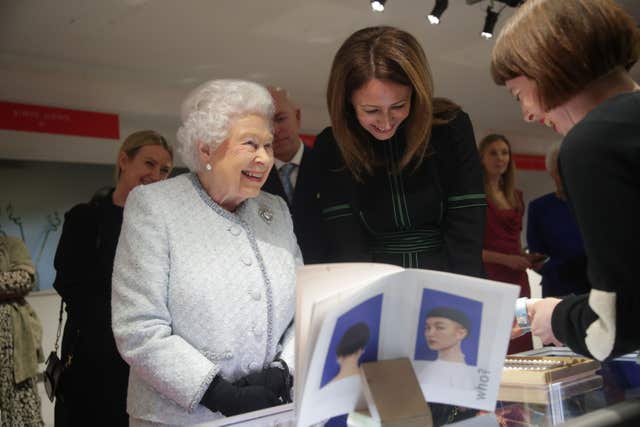The Queen talks to a exhibitor at the London Fashion Week showrooms (Yui Mok/PA)