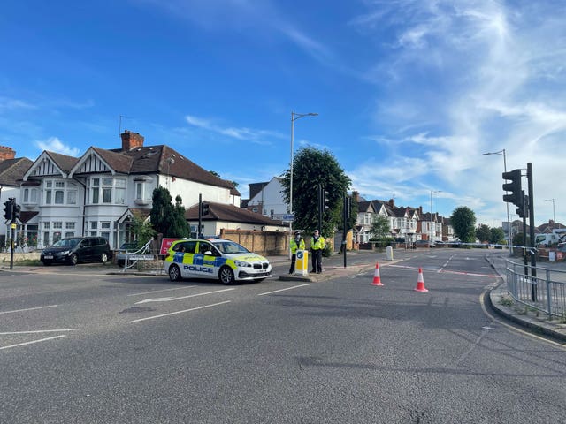 A police cordon at the scene in Cranbrook Road, Ilford, where a murder investigation is under way