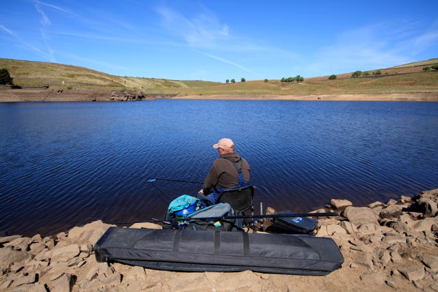 A man fishing at Dowry Reservoir (Danny Lawson/PA)