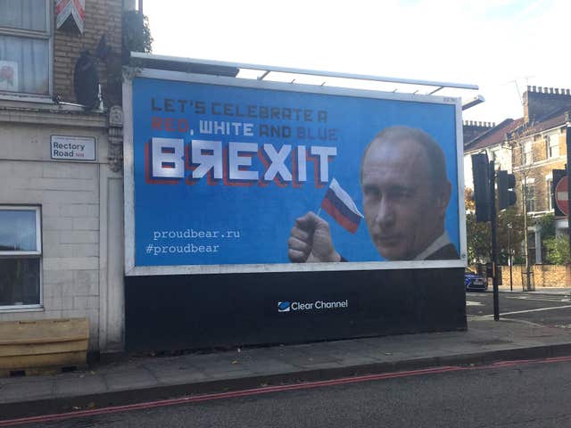 A billboard featuring Russian leader Vladamir Putin, in Stoke Newington, north London (Caitlin Doherty/PA)