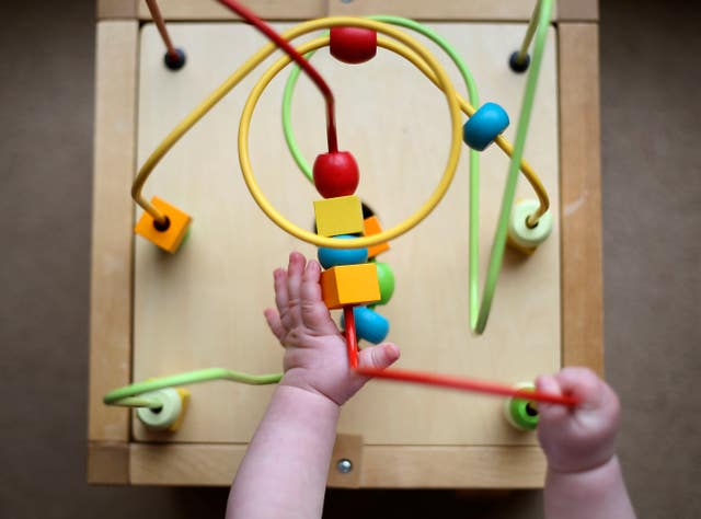 A young child playing with a toy