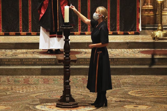 The Countess of Wessex lights a candle during the service. Jonathan Brady