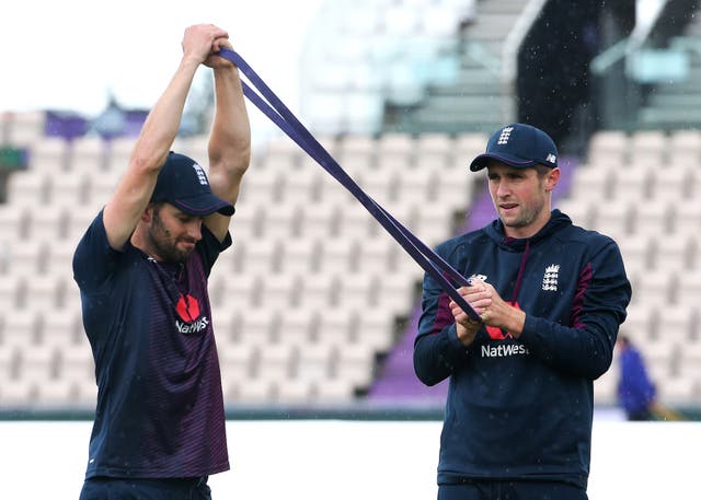 Mark Wood, left, and Chris Woakes warm up together ahead of a net session