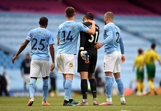 Aymeric Laporte, Ederson and Kyle Walker, second left to right with Fernandinho, left