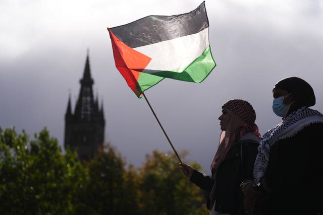People take part in a pro-Palestine protest outside the University of Glasgow Library, on the third anniversary of Hamas’s October 7 attacks