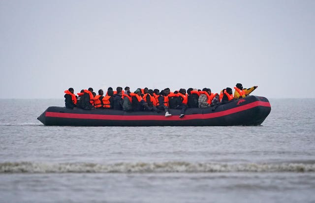 People thought to be migrants onboard a small boat in Gravelines, France