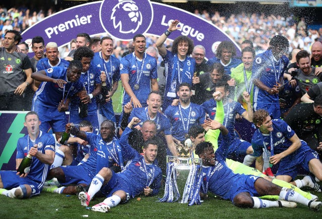 Chelsea players celebrate with the Premier League trophy in May 2017