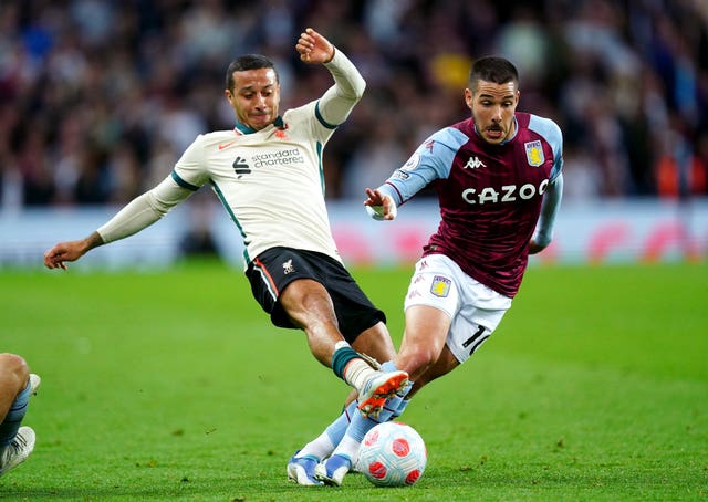 Liverpool’s Thiago Alcantara (left) tackles Aston Villa’s Emiliano Buendia during the Premier League match at Villa Park, Birmingham. Picture date: Tuesday May 10, 2022