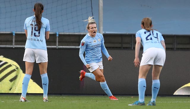 Manchester City’s Lauren Hemp, centre, celebrates her goal 