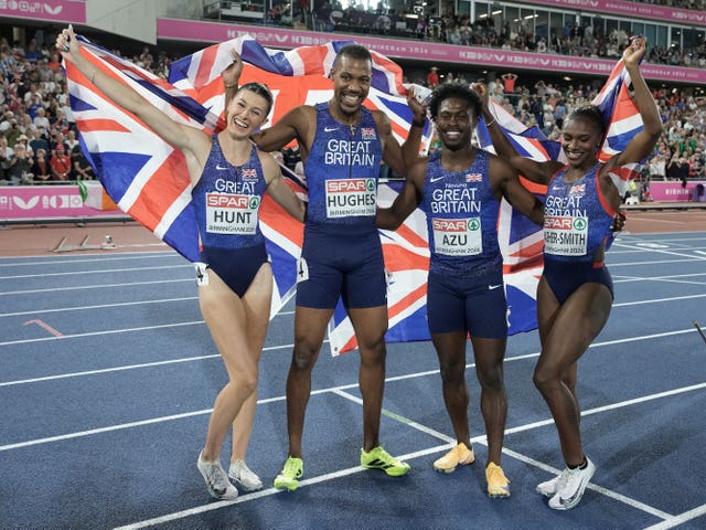 Jeremiah Azu (second right), Dina Asher-Smith (right), Zharnel Hughes and Amy Hunt (left) of Great Britain celebrate winning gold