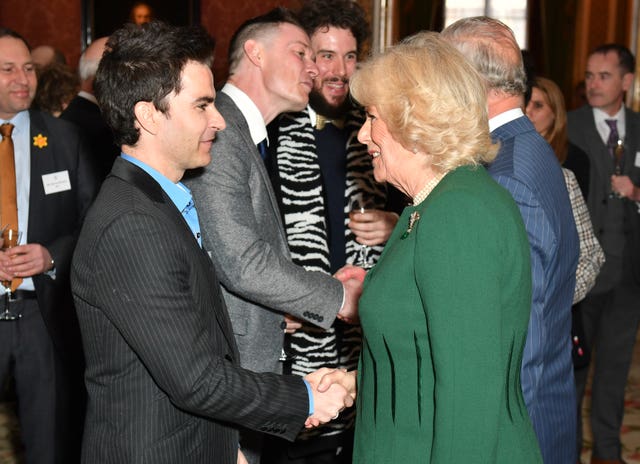 The Duchess of Cornwall speaks with Kelly Jones, lead singer of Stereophonics, at a reception at Buckingham Palace