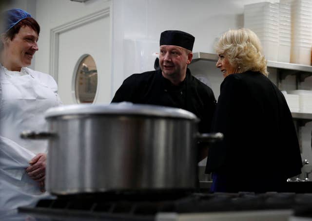 Camilla speaks to kitchen staff during her visit to The Clink restaurant at HMP Styal in Wilmslow (Phil Noble/PA)