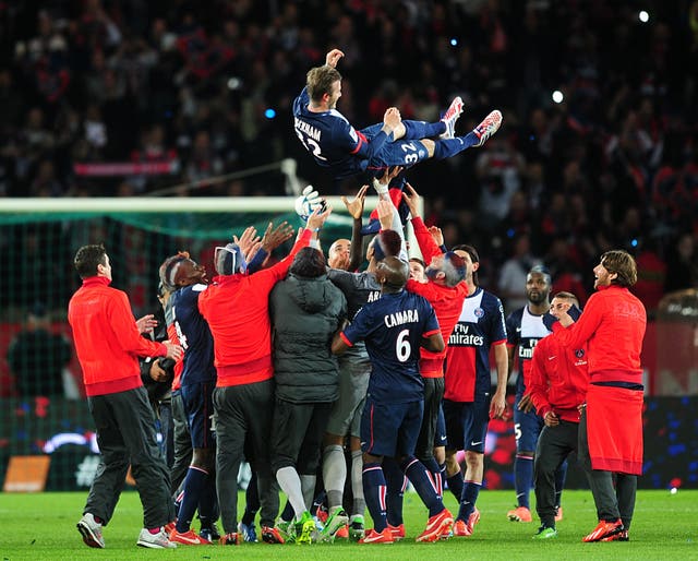 David Beckham is thrown into the air by his Paris St Germain team-mates after playing his final game as a professional