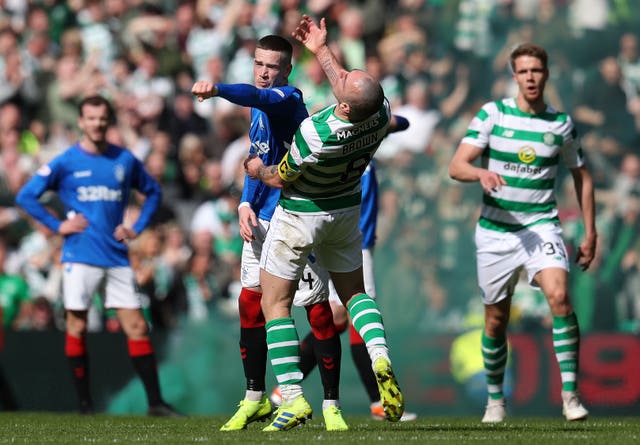 Tempers flare between Rangers' Ryan Kent, left, and Celtic's Scott Brown in the Old Firm derby