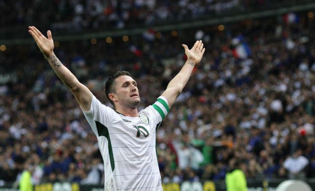 Republic of Ireland striker Robbie Keane celebrates after scoring at the Stade de France