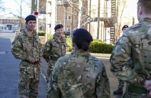 Lt Col Shamus Kelly and his wife Lt Col Lyndsey Kelly talk to soldiers